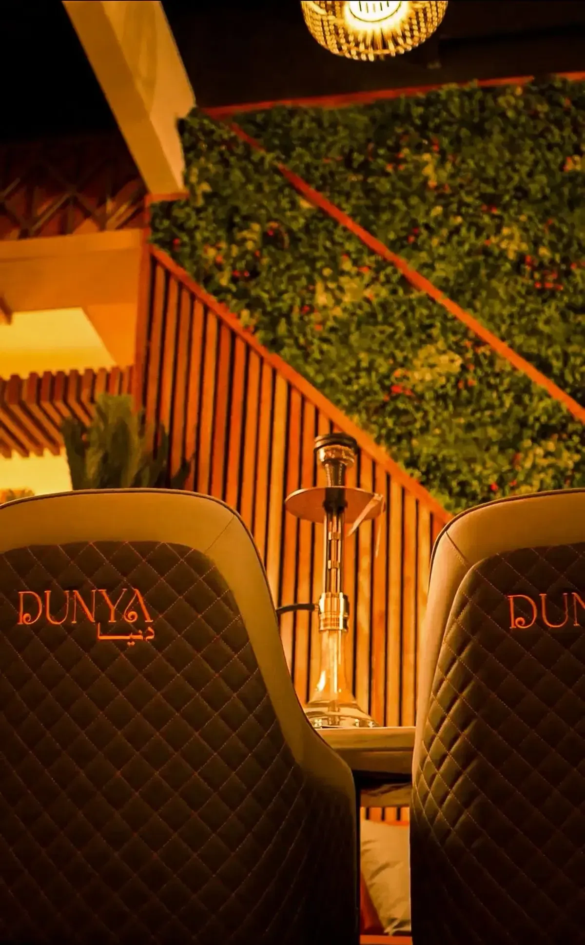 Premium DUNYA hookah between branded leather booths