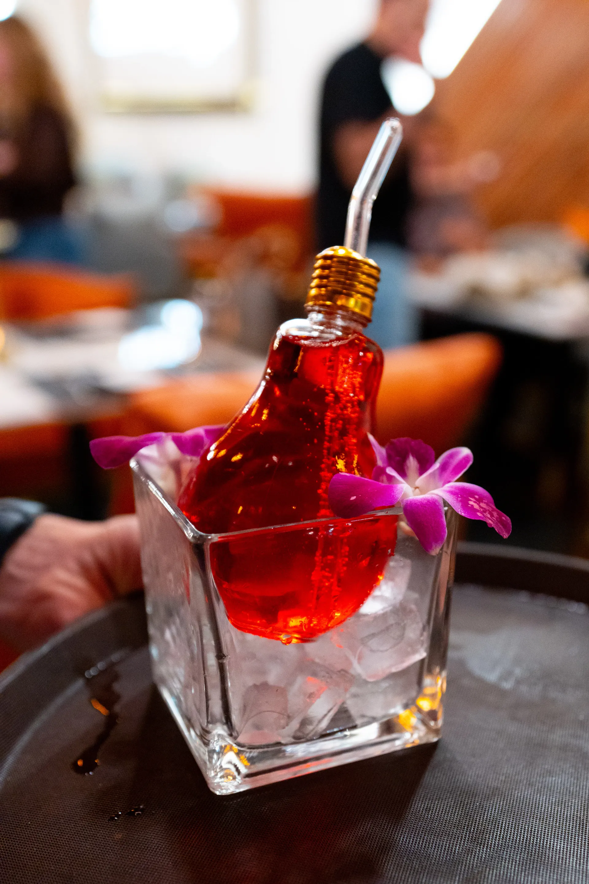 DUNYA signature zero-proof drink in warm evening light